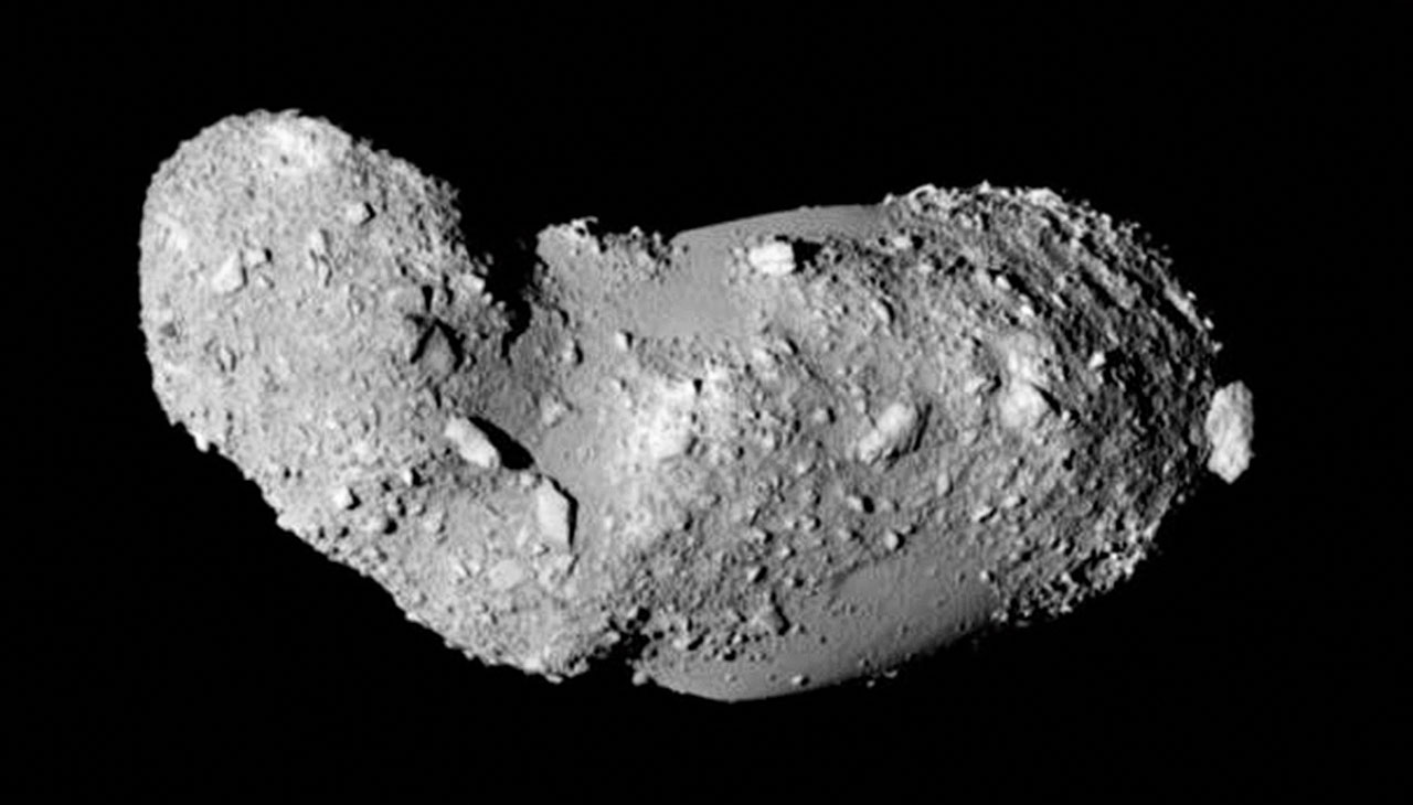 This very detailed view shows the strange peanut-shaped asteroid Itokawa. By making exquisitely precise timing measurements using ESO’s New Technology Telescope a team of astronomers has found that different parts of this asteroid have different densities. As well as revealing secrets about the asteroid’s formation, finding out what lies below the surface of asteroids may also shed light on what happens when bodies collide in the Solar System, and provide clues about how planets form. This picture comes from the Japanese spacecraft Hayabusa during its close approach in 2005.