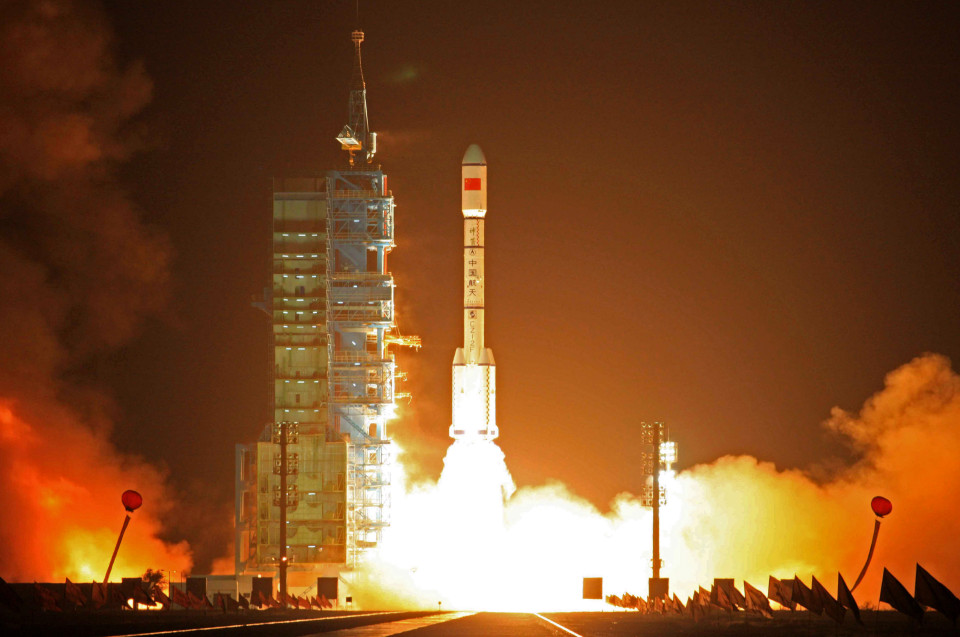 In this photo released by China's Xinhua News Agency, a Long March-2FT1 carrier rocket loaded with Tiangong-1 unmanned space lab module blasts off from the launch pad at the Jiuquan Satellite Launch Center in northwest China's Gansu Province, Thursday, Sept. 29, 2011. China launched the experimental module to lay the groundwork for a future space station on Thursday, underscoring its ambitions to become a major space power. (AP Photo/Xinhua, Wang Jianmin) NO SALES